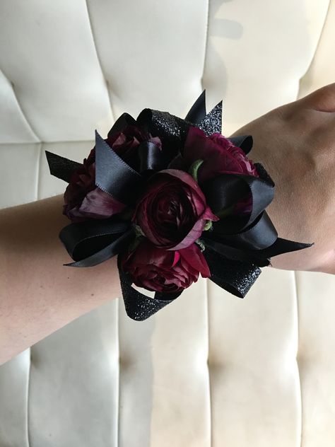 Pomp&Bloom dark burgundy and black corsage Prom Corsage And Boutonniere Burgundy, Red Black Corsage, Red And Black Wrist Corsage Prom, Black And Maroon Corsage, Corsages For Prom Burgundy, Emo Corsage, Gothic Corsage Prom, Burgundy Corsage Prom, All Black Corsage