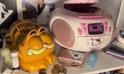 garfeild garf crystals camera cd player hello kitty cute cds vintage retro aesthetic 2000s core telephone landline cool blurry pixelated Cd Player Aesthetic, Hello Kitty Cd Player, Hello Kitty Landline Phone, Cute Cd Player, Vintage Cd Player, Hello Kitty Tea Cup Alarm Clock, Mini Pink Dvd Player, 2000s Cd Player, Aesthetic 2000s