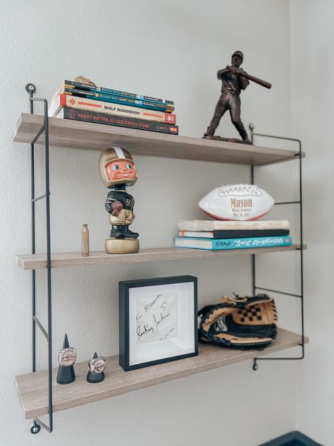 Office With Sports Memorabilia, Man Shelf Decor, Teen Boy Shelf Decor, Men Shelf Decor, Sports Shelf Display Shelves, Subtle Sports Decor, How To Display Sports Memorabilia, Football Display Ideas, Sports Memorabilia Display Ideas