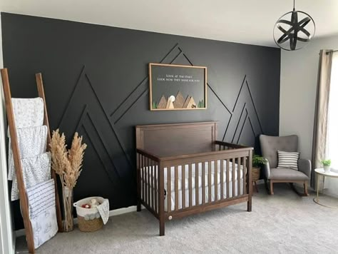 Black White Brown Nursery, Green Nursery Brown Crib, Dark Wood Trim Nursery, Black Wall In Nursery, Modern Industrial Nursery, Nursery With Dark Accent Wall, Dark Green Nursery Wall, Diy Wood Accent Wall Nursery, Diy Mountains On Wall