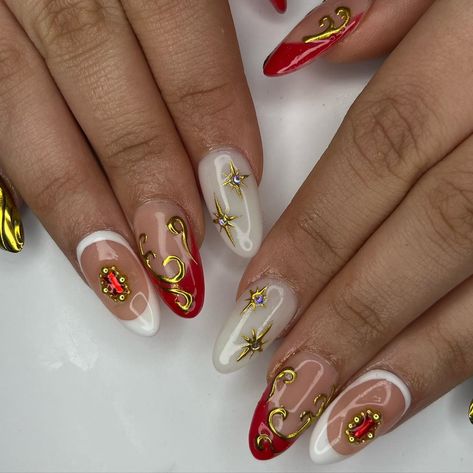 red and gold freestyle 🧨🍒✨⚜️ using: @beetlesgelpolish - medium almond tips - polishes @makartt_official - rhinestone glue #nails #nailinspo #nailart #gel #gelnaildesign #gelpolish #gelinspo #nailsnailsnails #gelx #gelextensions #gelxinspo #rednails #redandgoldnails #goldnails #renaissance #renaissancenails Red With Gold Design Nails, Red White Gold Nails, Red White Gold Nails Design, Red And Golden Nails Design, Red And Gold Swirl Nails, Red Nails With Gold Charms, White Gold Nails, Almond Tips, White Nails With Gold