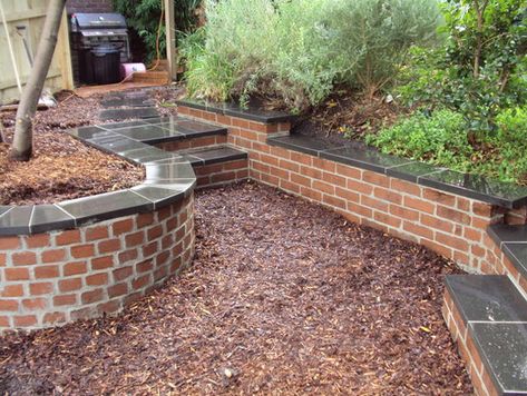 Retaining Walls – Garden Effects – Landscaping Mornington Peninsula Red Brick Retaining Wall Ideas, Red Brick Garden Wall, Brick Retaining Wall Garden, Brick Raised Beds, Gardening Beds, Brick Wall Gardens, Brick Courtyard, Sunken Patio, Brick Garden Edging