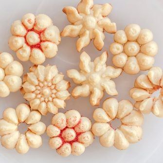 Our Favorite Spritz Cookie Recipes | Taste of Home Almond Spritz Cookies, Cookie Press Recipes, Classic Christmas Recipes, Pampered Chef Cookie Press, Unique Christmas Cookies, German Christmas Food, Spritz Cookie Recipe, Traditional Christmas Cookies, Christmas Cookie Recipes Holiday