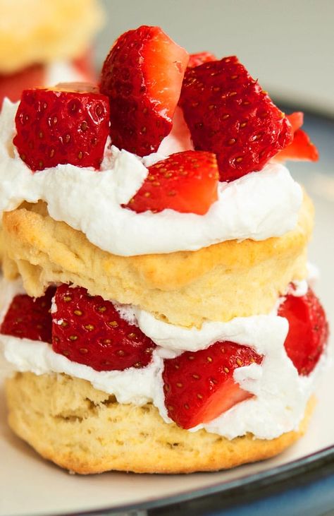 The best, classic, quick and easy strawberry shortcake recipe, homemade with simple ingredients. This dessert is composed of flaky biscuits, filled with sweetened strawberries and whipped cream. Starts off with Bisquick mix. You can use those three components (light and fluffy biscuits, sweet strawberries, fresh whipped cream) to make strawberry shortcake ice cream, trifles, cheesecake, cakes and cupcakes. This is a 'short cake' and different than your typical soft and moist cakes. It has a ... Bisquick Shortcake Recipe, Bisquick Strawberry Shortcake, Strawberry Shortcake Recipe Easy, Shortcake Biscuits, Easy Strawberry Shortcake, Shortcake Cake, Strawberry Shortcake Cake, Recipes With Whipping Cream, Strawberry Shortcake Recipes