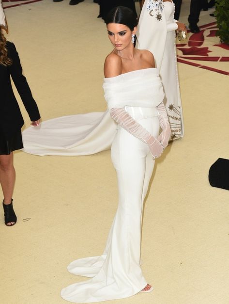 Kendall Jenner in a white bustier top with matching sheer gloves White Prom Dress With Gloves, Bridal Gown With Gloves, Wedding Dress With Tulle Gloves, Sheer Gloves Wedding, Tulle Gloves Outfit, Simple Wedding Dress With Gloves, Sheer Gloves Outfit, Wedding Gown With Gloves, White Dress With Gloves