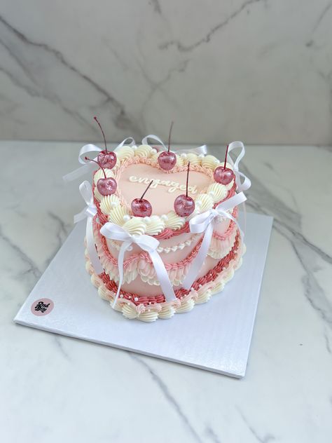 Coquette vintage heart cake with bows and pink glittter cherries Croquette Birthday Cake, Cute Vintage Cakes, Heart Shape Vintage Cake, Cherry Vintage Cake, Coquette Heart Cake, Vintage Cake With Bows, Heart Cake With Bows, Birthday Cake With Bows, Vintage Cake With Cherries