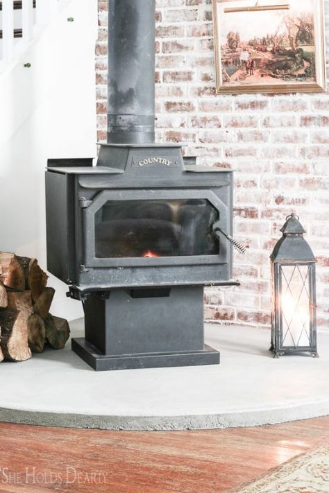 14 DIY Concrete Hearth Under Woodburning Stove In Farmhouse Renovation, By She Holds Dearly Featured On @Remodelaholic 1906 Farmhouse, Tile Hearth, Concrete Hearth, She Holds Dearly, Wood Stove Hearth, Cement Home, Beach House Living Room, Farmhouse Renovation, Freestanding Fireplace