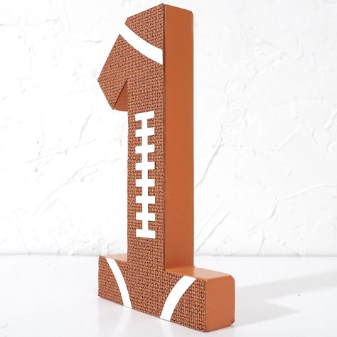 PRICES MAY VARY. FOOTBALL NUMBER 1 STANDING DECOR - Unique And Stylish Football Birthday Decor Features A Standing Design That Displays The Number 1 In A Playful Look With A Hint Of Whimsy, And It Will Create A Passionate And Energetic Atmosphere For Your Party. 1ST BIRTHDAY PARTY DECORATIONS - This Football Number 1 Block Is Strong And Sturdy And Is Made To Last For A Long Time, You Can Display It On A Shelf Or Keep It In A Memory Box To Relive Those Precious First Birthday Memories For Years T 1st Year Down Football Birthday Centerpiece, First Year Down Centerpieces, Football Birthday Party Ideas Decoration, First Down Birthday Theme, Sports Theme 1st Birthday, 1st Down Football Birthday Party, Kids Football Birthday Party, First Birthday Football Theme, 1st Year Down Football Birthday