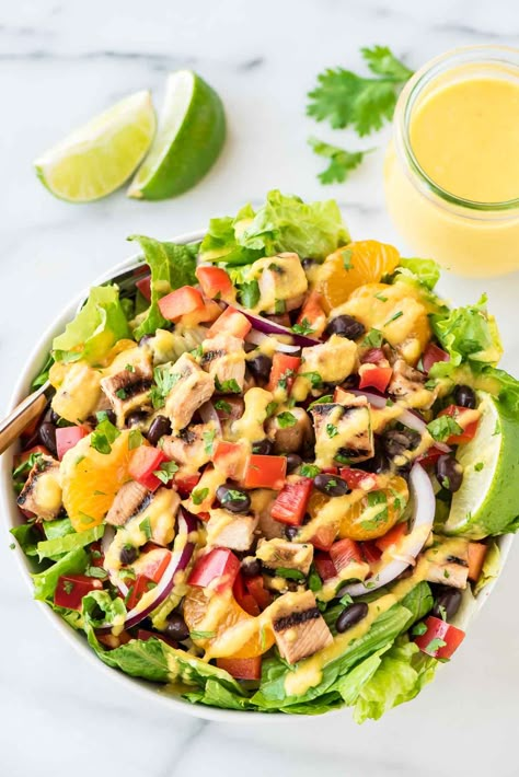 A recipe for grilled Caribbean Chicken Salad packed with crisp veggies, black beans, juicy chicken and sweet oranges, topped with a tangy mango dressing. Caribbean Salad, Mango Salad Dressing, Mango Dressing, Chicken Salad Dressing, Caribbean Chicken, Mango Chicken, Salad Dressing Recipe, Mango Salad, Easy Salad Recipes