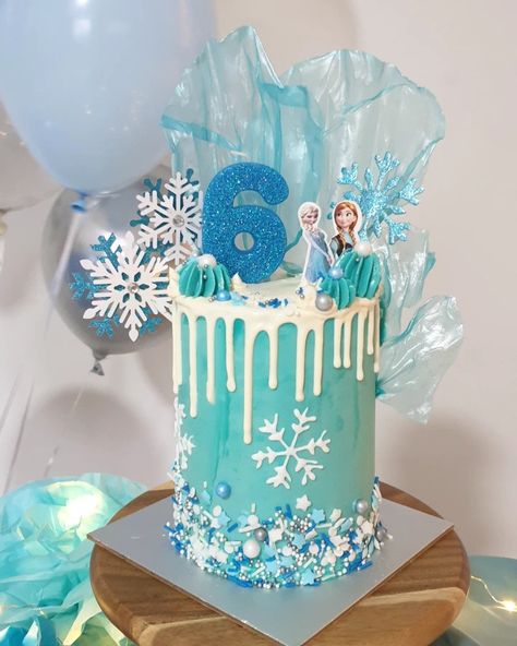 using sails and buttercream with white choc ganache drip Frozen Drip Cake, Simple Frozen Theme Cake, Choc Ganache, Ganache Drip, Princess Cupcake, Frozen Theme Cake, Princess Cupcake Toppers, Frozen Themed Birthday Party, Cake Decorating For Beginners