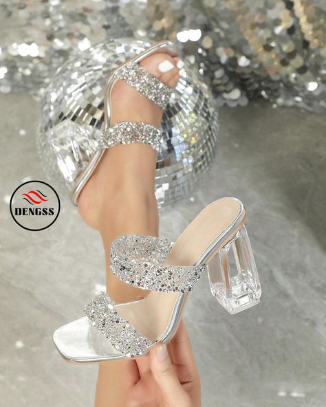 DENGSS Women's Summer Fashionable Glitter Decor Peep Toe Mules With Clear Chunky Heels And Crystal Block Heels, Suitable For Indoor And Outdoor Parties Color: Silver Heel Height: High Heel (9cm/3.5inch) Upper Material: Sequins Lining Material: PU Leather Insole Material: PU Leather Outsole Material: TPR Product Measurements in cm : Size AU Ball Girth Foot Length Heel Height EUR35 US5 20.9 22.93 9 EUR36 US6 21.35 23.6 9 EUR37 US6.5 21.8 24.27 9 EUR38 US7 22.25 24.94 9 EUR39 […]https://dengss.c... Clear Chunky Heels, Glitter Sandals, Glitter Decor, Silver Heels, Outdoor Parties, Colorful Party, Chunky Heels, Summer Women, Block Heels