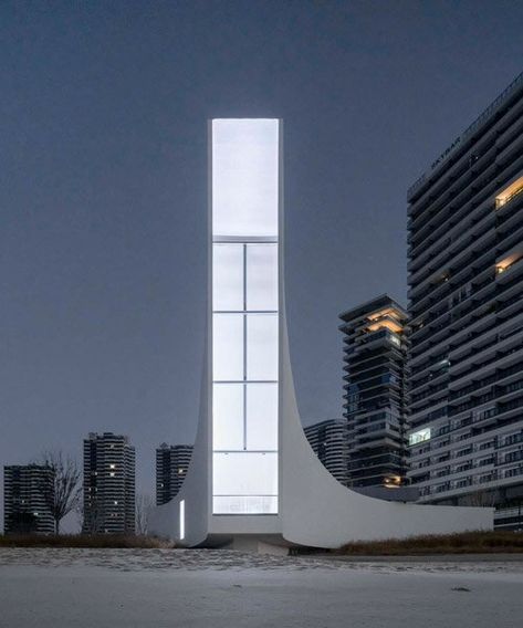 this chapel by o-office emerges as a floating pillar of light over jinting bay Sculptural Light, Arch Inspiration, Architecture Community, Painted Concrete Floors, China Architecture, Open Architecture, Concrete Light, Basement Floor Plans, Glazed Walls