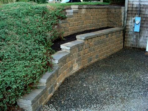 Segmental Retaining Walls After 1 | Mike Stacy Landscaping Tiered Garden Ideas Sloped Yard Retaining Walls, Retaining Wall Under Deck, Walk Out Basement Retaining Wall Ideas, Basement Retaining Wall Ideas, Walk Out Basement Landscaping, House Retaining Wall, Walkout Basement Landscaping, Tall Retaining Wall, House Slope