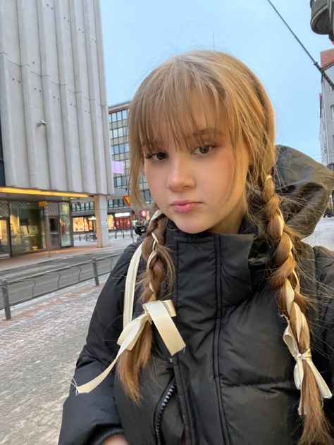 Girl with bangs and ribbon hairstyle, outside in the winter Double Braids With Ribbon, Lace Ribbon Hairstyles, Two Ponytails With Ribbon, Pigtail Braids With Bangs, Bangs With Two Braids, Braided Pigtails With Bangs, Ribbon Headbands Hairstyle, Fish Tail Braids Hairstyles, Ribbon Braid Hairstyle