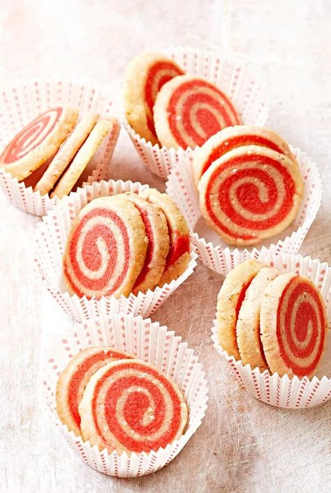 These pinwheel cookie recipes from Better Homes & Gardens are easy, beautiful, delicious and perfect for holiday cookie swaps. #pinwheelcookies #christmascookies #cookierecipes #bhg Pinwheel Cookies Recipe, Swirl Cookies, Refrigerated Cookie Dough, Icebox Cookies, Pinwheel Cookies, Cinnamon Roll Cookies, Chocolate Babka, Buttery Cookies, Sugar Cookie Dough