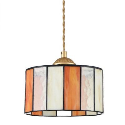 With multiple color splicing, this tiffany hanging light features a handmade cylinder-shaped stained glass lampshade, showing a vintage and elegant scene in your living spaces. With adjustable hanging wire, the stained glass hanging light is ideal for kitchen island, dining roon, bedroom, hallway, stairway, foyer, bar, office and more. Shade Color: Orange/Cream, Size: 5.9" H x 7.7" W x 7.7" D | Ebern Designs Tiffany Hanging Light Stained Glass Pendant Lighting yellow in Orange / Cream | 5.9" H x 7.7" W x 7.7" D | Wayfair