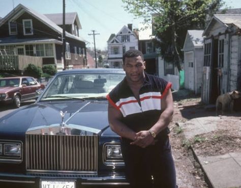 Mike Tyson poses infront of his Rolls Royce on a side street in New York (1987) - @MikeTyson #IronMike #KidDynamite Mike Tyson Boxing, Iron Mike, Celebrity Cars, Boxing Posters, Boxing History, Boxing Quotes, Ufc Fighters, Sports Aesthetic, Black Cartoon