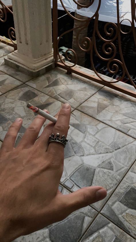 The strong hand of a man. With a ring in the shape of a crown, which is on the index finger. Middle finger and index finger hold a glowing cigarette. In dark style. Male Rings Aesthetic, Nico Aesthetic, Lorenzo Berkshire, Hands With Rings, Hot Hands, Hand Gloves, Male Hands, Fantasy Story, Hand Model