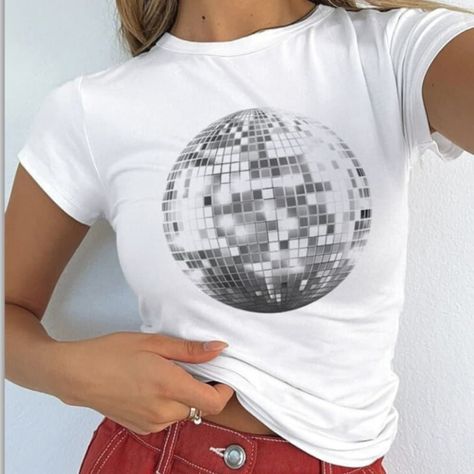 Elevate your style game with our Trendy Disco Ball T-shirt - the epitome of chic meets playful! ✨ This head-turning tee is designed to make a statement, ensuring you stand out in any crowd. The dazzling disco ball graphic adds a touch of sparkle, bringing a burst of energy to your wardrobe. 💃 The perfect fusion of fashion and function, our T-shirt boasts an amazing fit that accentuates your curves with a baby tee cut that's both trendy and comfortable. It's not just an outfit; it's a mood enhancer, radiating positivity and infectious energy wherever you go. 🌟 Crafted with passion and attention to detail, this tee is made from premium materials that guarantee a soft, breathable feel against your skin. Whether you're hitting the dance floor or simply hanging out with friends, our Trendy Di Mirrorball Print, Goth Tshirt, Harajuku Aesthetic, Balls Shirt, 90s Baby, Mirror Ball, Baby Tees, Y2k Clothing, Retro Shirts