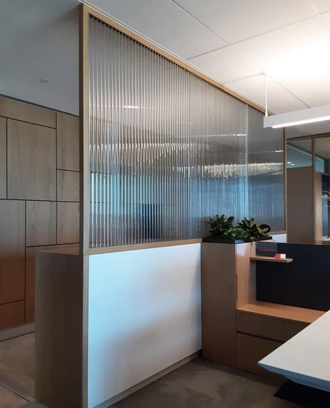 Featuring stunning translucent kiln-formed partitions by Nathan Allan, made with 10mm crystal clear Cathedral Glass. Stay tuned for more!  #glass #design #interiordesign #architecture #luxury #castglass #dividers #architecturalglass #artglass #glasswall #glassart #officedesign #office #officespace #partitions #walls #facades #healthcaredesign #retaildesign #hospitals #residential #hotels #hospitality #construction #retail #fluted #homedesign #flutedglass #thickglass Office Partition Design, Office Partitions Wall, Glass Partition Designs, Office Cabin Design, Glass Office Partitions, Modern Partition Walls, Glass Partition Wall, Office Dividers, Wall Partition Design