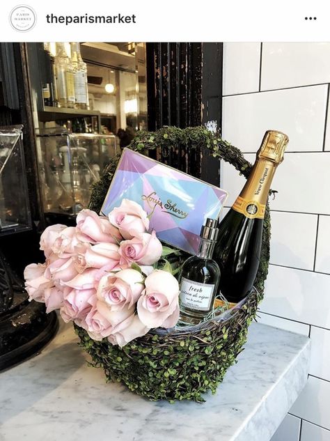 Basket of flowers, chocolate and champagne.  A great gift for so many occasions. Champagne Basket, Champaign Gift Basket, Champagne And Flowers Gift, Champagne Bottle Floral Arrangement, Champagne Theme Gift Basket, Champagne Ice Bucket With Flowers, Wine Themed Gifts, Fundraiser Baskets, Champagne Flowers