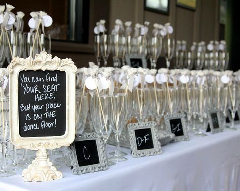 Seat chart with champagne toasting glasses/stir sticks. Wedding Favor Table, Wedding Seating Cards, Bridal Shower Champagne, Best Champagne, Wedding Reception Fun, Wedding Reception Seating, Reception Seating, Seating Cards, Engagement Party Decorations