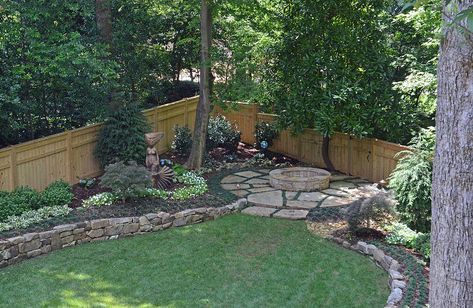 Drainage was a huge problem in this yard. Water from the five lots on the upper side of the house drained down the driveway, creating a "river" when it rained. Landscape Studio put in two catch basins and an earth berm to stop the water. We re-graded the backyard and installed a dry creek bed to redirect the water. Landscape Studio designed a privacy fence, planted annuals and perennials, added a raised planter for vegetable gardening, and found the perfect spot in this beautiful yard… Front Yard Landscaping Budget, Easy Front Yard Landscaping Budget, Easy Front Yard Landscaping, Landscaping Along Fence, Backyard Drainage, Mailbox Landscaping, Rock Garden Landscaping, Front House Landscaping, Home Landscaping