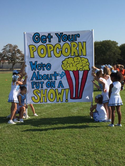 Cheer run thru sign - Get your popcorn, we're about to put on a show!! Popcorn Parade Float Ideas, Football Run Thru Signs, Run Thru Banners Football Signs, Cheer Signs For Football Games, Cheer Spirit Ideas, Cheer Competition Signs Posters, Cheer Run Through Signs, Runthrough Signs Football, Playoff Football Signs