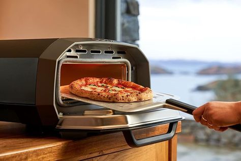 Oprah Winfrey is always full of great gifting tips, and right now, five of her favorite picks for cooks and food-lovers are on discount. Snag an Ooni pizza oven, truffle hot sauce, knife set, and more for up to 33% off. Pizza Cooker, Indoor Pizza Oven, Electric Pizza Oven, Portable Pizza Oven, Four A Pizza, Pizza Style, Pizza Maker, Countertop Oven, Great Pizza