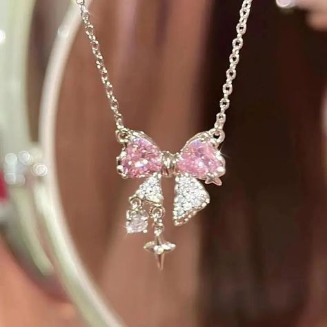 Add a touch of elegance with the Pink Bowknot Cross Pendant Necklace! This charming piece features a new Korean design with a delicate bowknot and sparkling pink zircon cross pendant. Perfect for fashion-forward women, this trendy necklace combines classic style with modern flair. Crafted from zinc alloy with a chic O-chain, it's ideal for adding a sophisticated touch to any outfit, whether for a party or a special occasion. The Pink Bowknot Cross Pendant Necklace is not just a fashion accessory Necklaces Korean, Pink Zircon, Vintage Pendant Necklace, Y2k Necklace, Crystal Heart Pendant, Trendy Necklace, Bow Necklace, Stylish Necklace, Pretty Jewelry