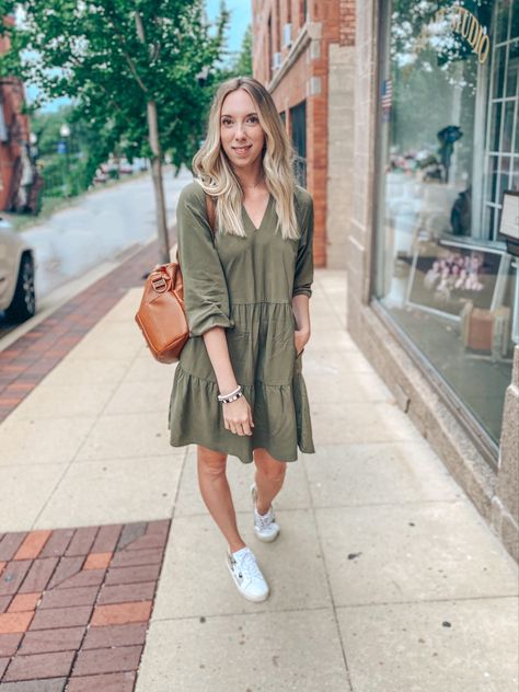 Girl wearing short olive green dress with pockets, sneakers, carrying brown leather diaper bag Olive Green Dress Casual Summer, Olive Green Fall Dress, Olive Green Dress Outfit Fall, Olive Dress Casual, Green Dress Outfit Casual, Olive Green Dress Casual, Olive Dress Outfit, Army Green Dress Outfit, Olive Green Dress Outfit