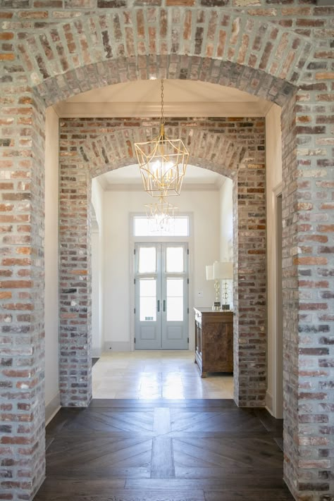 Interior Brick Accents, Brick Wall Foyer, Brick Archway In Living Room, Arched Brick Entryway, Brick Arch Entryway, Brick Arches Interior, Arch Brick Wall, Archway Painting, Brick Arch Foyer