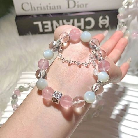 🌙Introducing our exquisite Rose & Clear Quartz Moonstone Tassel Crystal Bracelet – a harmonious blend of timeless beauty and positive energy. This meticulously crafted bracelet combines the healing properties of Rose Quartz, Clear Quartz, and the ethereal charm of moonstone, creating a stunning accessory that not only elevates your style but also enhances your well-being. 🌹 Rose Quartz: Love and Harmony 💎 Clear Quartz: Clarity and Amplification 🌙 Moonstone: Intuition and Feminine Energy 📿 ... Elegant Beaded Rose Quartz Crystal Bracelet, Tassel Bracelet Diy, Silver Rose Quartz Crystal Bracelet Spiritual, Spiritual Rose Quartz Crystal Bracelet, Crystal Bracelets Diy, Hand-strung Rose Quartz Crystal Bracelet For Healing, Adjustable Rose Quartz Crystal Bracelet, Spiritual Style, Cloud Bag, Diy Tassel