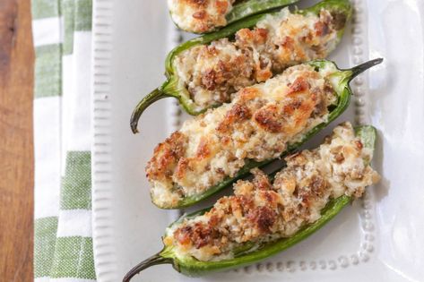 These sausage stuffed jalapeños are also filled with cream cheese and baked to perfection. Trust us when we say they're a must-have appetizer at your next party. Sausage Air Fryer, Crescent Sausage Bites, Sausage Stuffed Jalapenos, Cream Cheese Stuffed Jalapenos, Stuffed Jalapeños, Stuffed Jalapenos, Spicy Appetizers, Jalapeno Pepper, Jalapeno Recipes