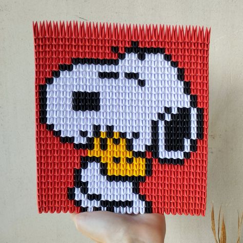 This origami pixel art features Snoopy and Woodstock from Peanuts hugging. It is made using 1/64 A4 80 gsm coloured paper pieces which are stacked together. The dimensions of this origami are 17 * 19 * 1,5 cm.  Cautions  As this piece is made entirely out of paper please keep away from damp environments and fire sourses. Also please DO NOT BEND! Peanuts Art, Snoopy Und Woodstock, Paper Dog, Lego Mosaic, 3d Pixel, Paper Dogs, Coloured Paper, Origami 3d, Art Origami