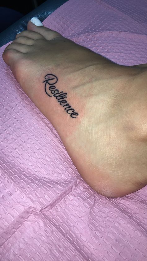 Resilience #foot #tattoo #resilience #resilient #small #cursive Resilient Neck Tattoo, Resilience Tattoo Ideas Symbols, Resilient Tattoo, Freedom Tattoo, Resilience Tattoo, Freedom Tattoos, Omerta Tattoo, Arm Tattoos For Women, Tattoo Font