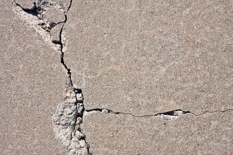 Solved! What to Do About Cracks in a Concrete Driveway - Bob Vila Fix Cracked Concrete, Repair Concrete Driveway, Concrete Floor Repair, Vogue Decor, Concrete Refinishing, Cement Driveway, Repair Cracked Concrete, Concrete Repair Products, Driveway Repair