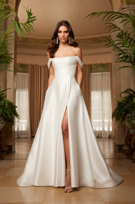 This strapless Mikado pleated bodice with a shallow scoop neckline is a modern classic. The detachable Mikado draped sleeves add a touch of whimsy, while the full Mikado wrap skirt with side front pleat opening and pockets is simply stunning. Paloma Blanca Wedding Dress, High Fashion Couture, White Bridal Dresses, Bridal Gallery, Draped Sleeves, Country Dresses, The Modern Bride, Dream Wedding Ideas Dresses, Beautiful Prom Dresses