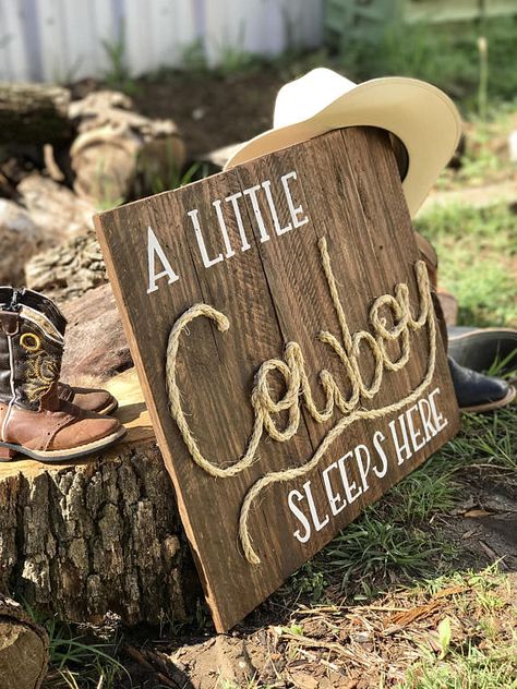 Cowboy nursery pallet sign a little cowboy sleeps here