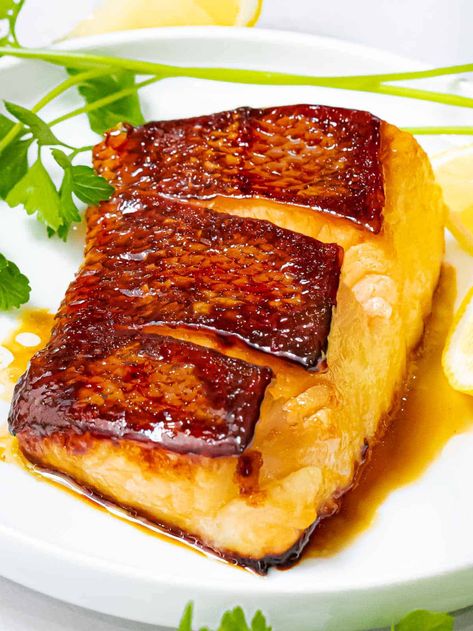 This pan seared Chilean sea bass is flavored with a delicious Asian marinade of soy sauce, ginger, and mirin. It's perfectly pan fried until it’s flaky and tender with an incredibly crispy skin! #seabass #chileanseabass #asianseabass #fishrecipe #drivemehungry | drivemehungry.com Chilean Sea Bass Recipe Pan Seared, Cooking Sea Bass, Grilled Sea Bass, Asian Marinade, Sea Bass Recipes, Teriyaki Marinade, Fish Dinner Recipes, Easy Asian Recipes, Easy Asian