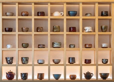 Living Water Tea House Japanese Tea Shop Interior, Tea House Design Interior, Japanese Shelf Design, Tea Shop Display, Japanese Tea House Design, Chinese Tea Room Interior, Tea Organization Ideas, Tea Cafe Design, Tea House Aesthetic