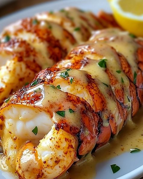 Want to impress your guests with a luxurious dish? These creamy garlic butter lobster tails are the way to go! Creamy Garlic Butter Lobster Tails 🦞🧄🧈 Ingredients: 2 lobster tails 4 tablespoons unsalted butter 4 cloves garlic, minced ½ cup heavy cream ½ teaspoon paprika Salt and pepper to taste 1 tablespoon lemon juice Fresh parsley, chopped (for garnish) Lemon wedges (for serving) Directions: Prepare the Lobster Tails: Preheat the oven to 425°F (220°C). Use kitchen scissors to cut the top s... Sauce For Lobster Tail, Lobster Tail Presentation, Garlic Butter Lobster, Butter Poached Lobster Tail, Lobster Tail Recipe, Butter Lobster, Butter Poached Lobster, Lobster Dishes, Lobster Recipes Tail