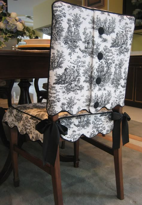 This is my Scalloped Edge Toile Chair Suit® with covered button closure; shown here in black and white toile. The skirt ties on with coordinated satin ribbon ties. Both the jacket and skirt are lined. Each set is custom made to fit your chair. Available in other colored toiles as well. Dry clean only. Diy Slipcover, Dining Room Chair Covers, Parsons Chair, Bantal Sofa, Seat Covers For Chairs, Dining Chair Covers, Black And White Fabric, Dining Chair Slipcovers, Colorful Chairs