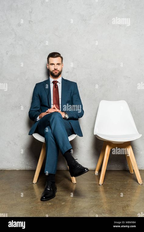 Download this stock image: handsome bearded man sitting with crossed legs on chair in office - WBM9B4 from Alamy's library of millions of high resolution stock photos, illustrations and vectors. Man Sitting Cross Legged On Chair, Men Sitting Cross Legged, Sitting Cross Legged Reference Chair, Man In Suit Sitting In Chair, Guy Sitting Cross Legged Reference, Lap Sitting Drawing Reference, Sitting Legs Crossed Reference, Guy Sitting In Chair, Legs Crossed Reference