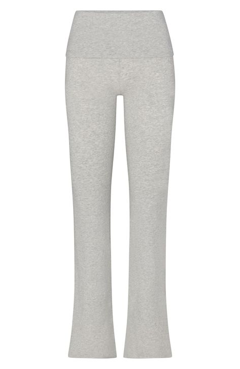 These go-to lounge pants from Kim Kardashian's SKIMS line are cut from soft cotton jersey with a deep fold-over waist. 32" inseam; 19" leg opening; 10" front rise; 13 1/2" back rise (size Medium) 90% cotton, 10% elastane Machine wash, tumble dry Imported Shifting Wardrobe, Grey Yoga Pants, Yoga Pants Outfit Aesthetic, Fall Fit, Navy Blue Shorts, Form Fitting Dress, Yoga Set, Loungewear Set, Grey Pants