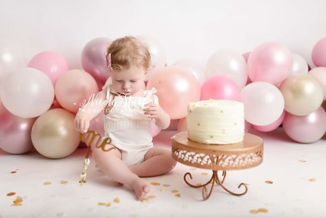 baby plays with cake topper in front of pink and gold balloon garland for cake smash with Nicole Starr Photography | Favorite Balloon garlands for cake smashes with a variety of themes shared by New York cake smash photographer Nicole Starr Photography. Pink Cake Smash Photoshoot, Pink Smash Cake Photoshoot, Rose Gold Smash Cake, Pink And Gold Cake Smash, Pink Cake Smash, Gold Cake Smash, Pink And Gold Cake, Pink Gold Cake, New York Cake