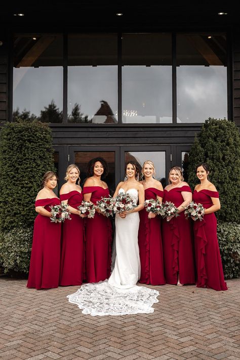 Bridal party with bridesmaids in off the shoulder red bridesmaid dresses holding rose bouquets Red And Blush Bridesmaid Dresses, Light Red Bridesmaid Dresses, Bridesmaid Dresses Red, Blue Bridesmaid Dresses Short, Wedding Theme Color Schemes, Indian Bridesmaid Dresses, Red Bridesmaid, Red Wedding Theme, Bride Attire