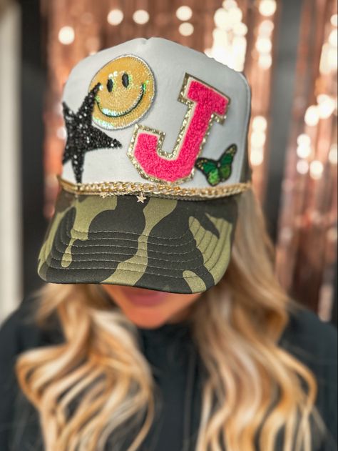 Custom-made, preppy, camo trucker hat made by MUDDY CREEK clothing boutique Sorority Trucker Hat Designs, Bride Trucker Hat With Patches, Patch Trucker Hat Diy, Trucker Hat Inspiration, Trucker Hat Display Ideas Craft Show, Preppy Trucker Hat, Custom Hat Bar Ideas, Trucker Hat Charms, Trucker Patch Hats