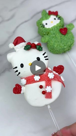 137K views · 8.3K reactions | Snowman Hello Kitty marshmallow pop ☃️🎀 Watch until the end for a surprise Hello Kitty pop. Do you want to see how I made her too? 💚♥️ To make these I used @campfiremarshmallows dipped in a blend of @stoverandcompany sweet shoppe ultra white and eleven o one deluxe melting wafers. I added their artisan accents chocolate chameleon candy color in white to make it bright white. I used a sour belt for the scarf and a mold for the bow and hat. 

#hellokitty #hellokittycore #hellokittycafe #hellokittyandfriends #sanrio #hellokittychristmas #christmas #christmastreats #christmasbaking #christmasideas #christmasparty #marshmallow #chocolatecoveredmarshmallows #marshmallowpops #marshmallows #christmasinspiration #christmasinspo #holiday #holidays #holidayseason #holi Hello Kitty Marshmallow, Hello Kitty Pop, Xmas Desserts, Christmas Food Treats, Chocolate Covered Marshmallows, Xmas Treats, Christmas Cake Pops, Marshmallow Treats, Chocolate Covered Treats