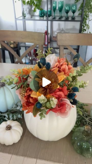 Michelle Beaton on Instagram: "It’s official after Labor Day I am decorating for Fall! This Fall pumpkin centerpiece took me under 10 minutes to make. It  would be perfect for Fall decor for your home or even a wedding or shower centerpiece. A glass jar could be added to the center to swap out faux flowers for real ones.   Do you decorate for Fall or Halloween? Or maybe neither?  #falldecor #diydecor #seasonaldecor #fallstyle  #pumpkincrafts #fallcrafts #diycrafts" Faux Pumpkin Centerpieces, Diy Pumpkin Centerpieces Fall, Pumpkin Decorating With Flowers, Pumpkin Decorating Flowers, Diy Fall Table Centerpieces Dollar Store, Faux Pumpkin Decorating Ideas, Pumpkin Baby Shower Centerpiece, Pumpkin Vase Centerpiece, Pumpkin Flower Centerpiece